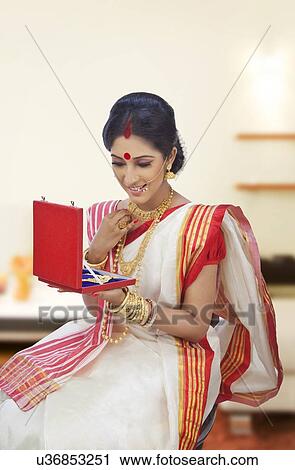 Stock Image - Bengali woman with a jewelery box. Fotosearch