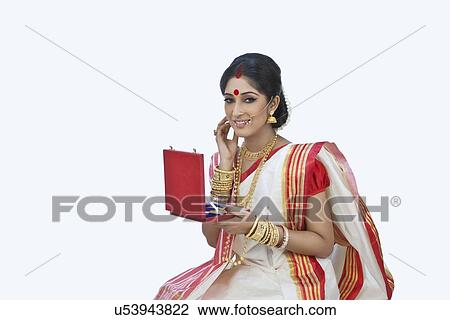 Stock Image - Bengali woman with a jewelery box . Fotosearch
