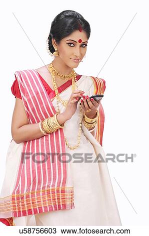 Bengali woman with a mobile phone View Large Photo Image Stock Image - Bengali woman with a mobile phone. Fotosearch