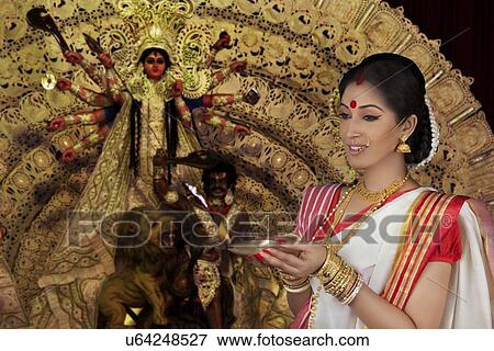 Stock Photo - Bengali woman with diya. Fotosearch