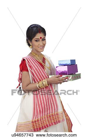 Stock Image - Bengali woman with gifts. Fotosearch
