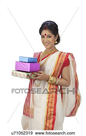 Bengali woman with gifts View Large Photo Image Stock Photo - Bengali woman with gifts. Fotosearch