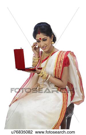 Stock Image - Bengali woman with jewelery box. Fotosearch