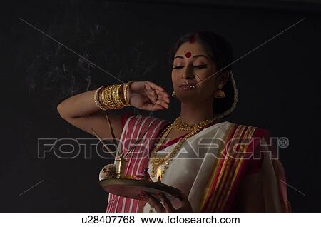 Bengali woman with puja thali View Large Photo Image Stock Photo - Bengali woman with puja thali. Fotosearch
