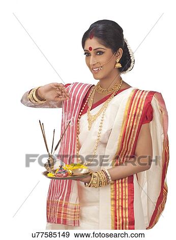 Stock Photo - Bengali woman with puja thali . Fotosearch