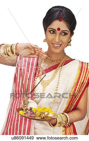 Stock Photo - Bengali woman with puja thali. Fotosearch