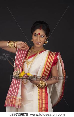 Stock Photography - Bengali woman with puja thali. Fotosearch