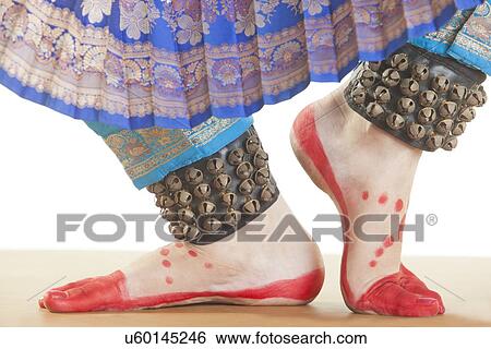 Bharatanatyam dancer's feet performing over white background View Large Photo Image Stock Photograph - Bharatanatyam dancer's feet performing over white background. Fotosearch