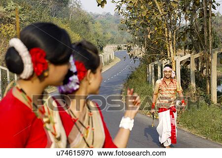 Bihu dancers gesturing at a male Bihu dancer View Large Photo Image Stock Image - Bihu dancers gesturing at a male Bihu dancer . Fotosearch