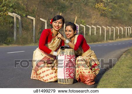 Bihu dancers looking at something View Large Photo Image Stock Photo - Bihu dancers looking at something . Fotosearch