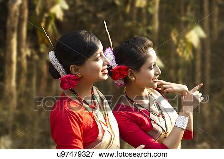 Bihu dancers looking at something View Large Photo Image Stock Photo - Bihu dancers looking at something . Fotosearch
