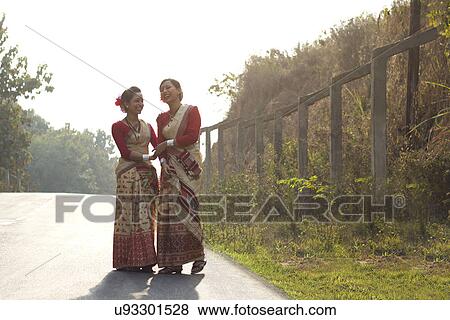 Bihu dancers sharing a laugh View Large Photo Image Stock Photo - Bihu dancers sharing a laugh . Fotosearch