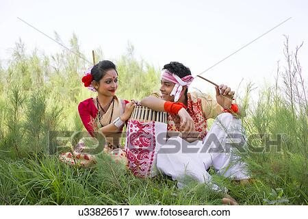 Stock Photo - Bihu dancers sitting together . Fotosearch