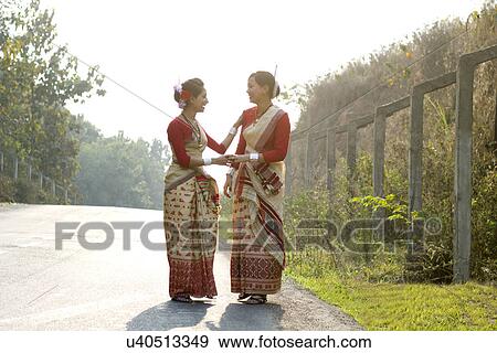 Bihu dancers smiling at each other View Large Photo Image Stock Photo - Bihu dancers smiling at each other . Fotosearch