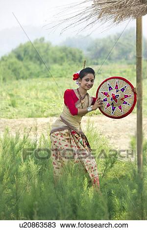Bihu woman holding a jaapi View Large Photo Image Stock Image - Bihu woman holding a jaapi . Fotosearch