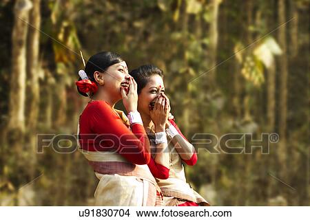 Picture - Bihu women dancers laughing . Fotosearch