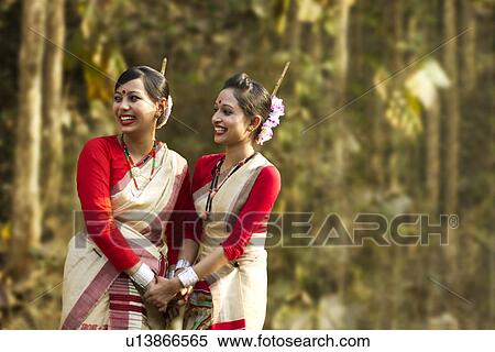 Stock Photography - Bihu women dancers smiling . Fotosearch