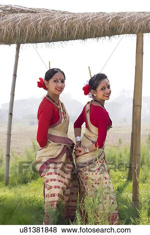 Stock Photo - Bihu women dancing together . Fotosearch