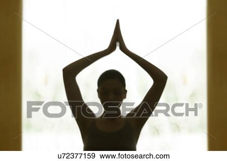Stock Photo - Blur image of woman meditating. Fotosearch