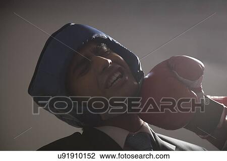 Boxer striking opponent View Large Photo Image Stock Image - Boxer striking opponent . Fotosearch