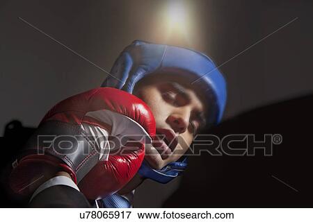 Boxer striking opponent View Large Photo Image Stock Photo - Boxer striking opponent . Fotosearch