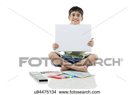 Picture - Boy holding a white board . Fotosearch