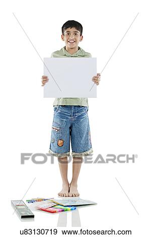 Stock Photo - Boy holding a white board . Fotosearch