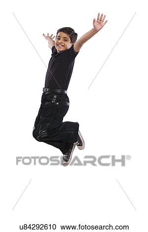 Boy jumping in the air View Large Photo Image Stock Image - Boy jumping in the air . Fotosearch