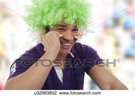 Boy with a wig talking on a mobile phone View Large Photo Image Stock Image - Boy with a wig talking on a mobile phone . Fotosearch