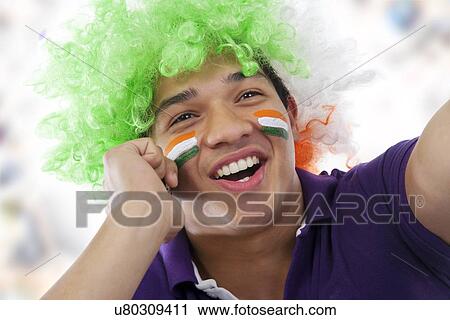 Boy with a wig talking on a mobile phone View Large Photo Image Stock Image - Boy with a wig talking on a mobile phone . Fotosearch