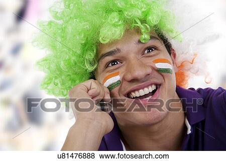 Boy with a wig talking on a mobile phone View Large Photo Image Stock Photo - Boy with a wig talking on a mobile phone . Fotosearch
