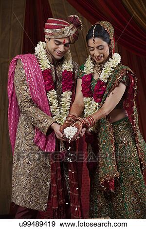 Stock Photo - Bride and Bridegroom during traditional ceremony . Fotosearch
