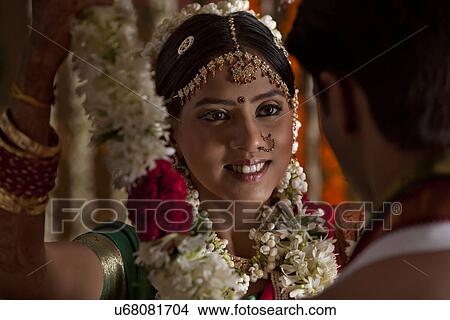 Bride and groom during wedding ceremony View Large Photo Image Picture - Bride and groom during wedding ceremony . Fotosearch