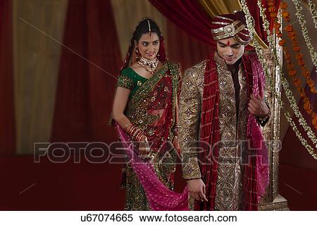 Bride looking at man during mangal phera View Large Photo Image Stock Photography - Bride looking at man during mangal phera . Fotosearch
