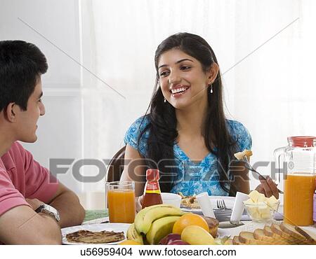 Brother and sister having breakfast View Large Photo Image Picture - Brother and sister having breakfast . Fotosearch