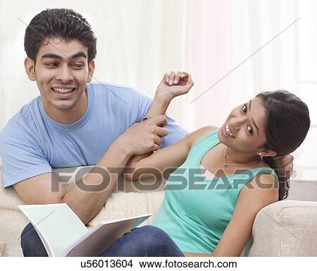 Brother teasing his sister View Large Photo Image Picture - Brother teasing his sister. Fotosearch