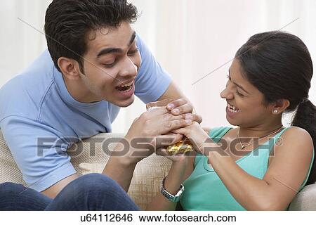 Brother teasing his sister View Large Photo Image Stock Photograph - Brother teasing his sister. Fotosearch