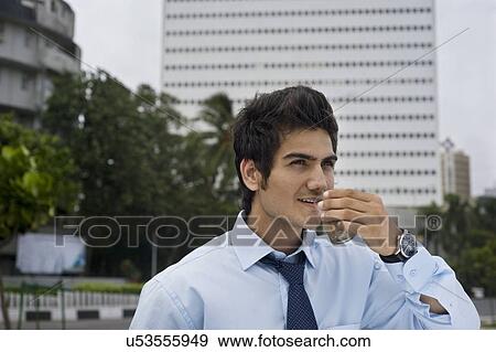 Businessman drinking tea View Large Photo Image Stock Photo - Businessman drinking tea . Fotosearch