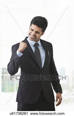 Stock Image - Businessman rejoicing . Fotosearch
