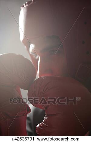 Businessman with boxing gloves in boxing stance View Large Photo Image Stock Image - Businessman with boxing gloves in boxing stance . Fotosearch