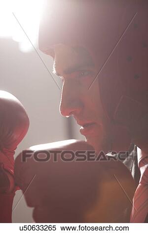 Stock Photography - Businessman with boxing gloves in boxing stance . Fotosearch