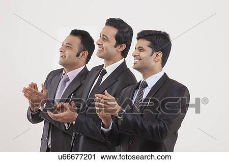 Businessmen clapping while watching cricket match View Large Photo Image Stock Image - Businessmen clapping while watching cricket match . Fotosearch