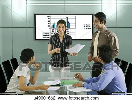 Businesspeople in a meeting View Large Photo Image Stock Image - Businesspeople in a meeting . Fotosearch