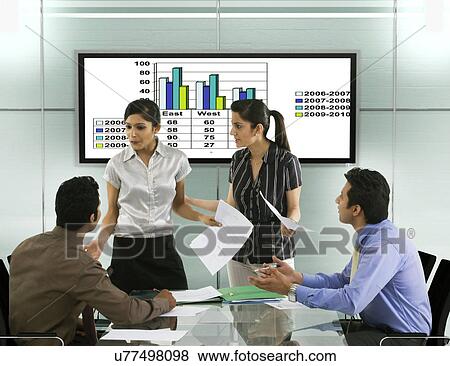 Businesspeople in a meeting View Large Photo Image Stock Photo - Businesspeople in a meeting . Fotosearch