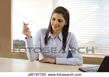 Stock Image - Businesswoman asking questions . Fotosearch