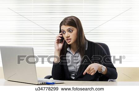 Stock Photo - Businesswoman getting annoyed . Fotosearch