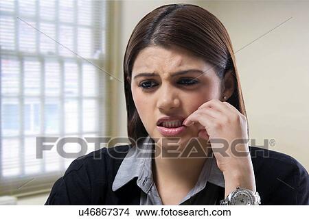 Businesswoman getting worried at work View Large Photo Image Picture - Businesswoman getting worried at work . Fotosearch