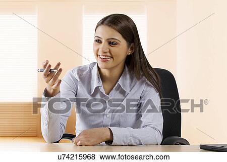 Stock Photo - Businesswoman having a discussion . Fotosearch