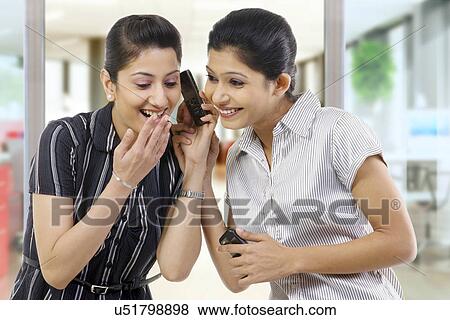 Stock Photo - Businesswoman having a laugh . Fotosearch