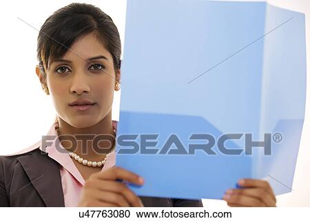 Businesswoman holding a file View Large Photo Image Stock Image - Businesswoman holding a file . Fotosearch